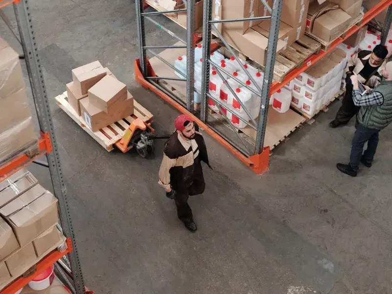 Warehouse pick of cartons on a pallet jack